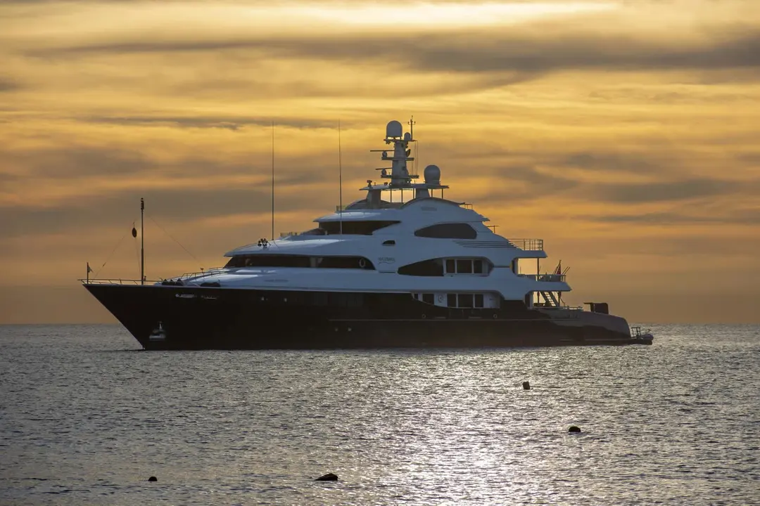 Premium motor yacht sailing at golden hour